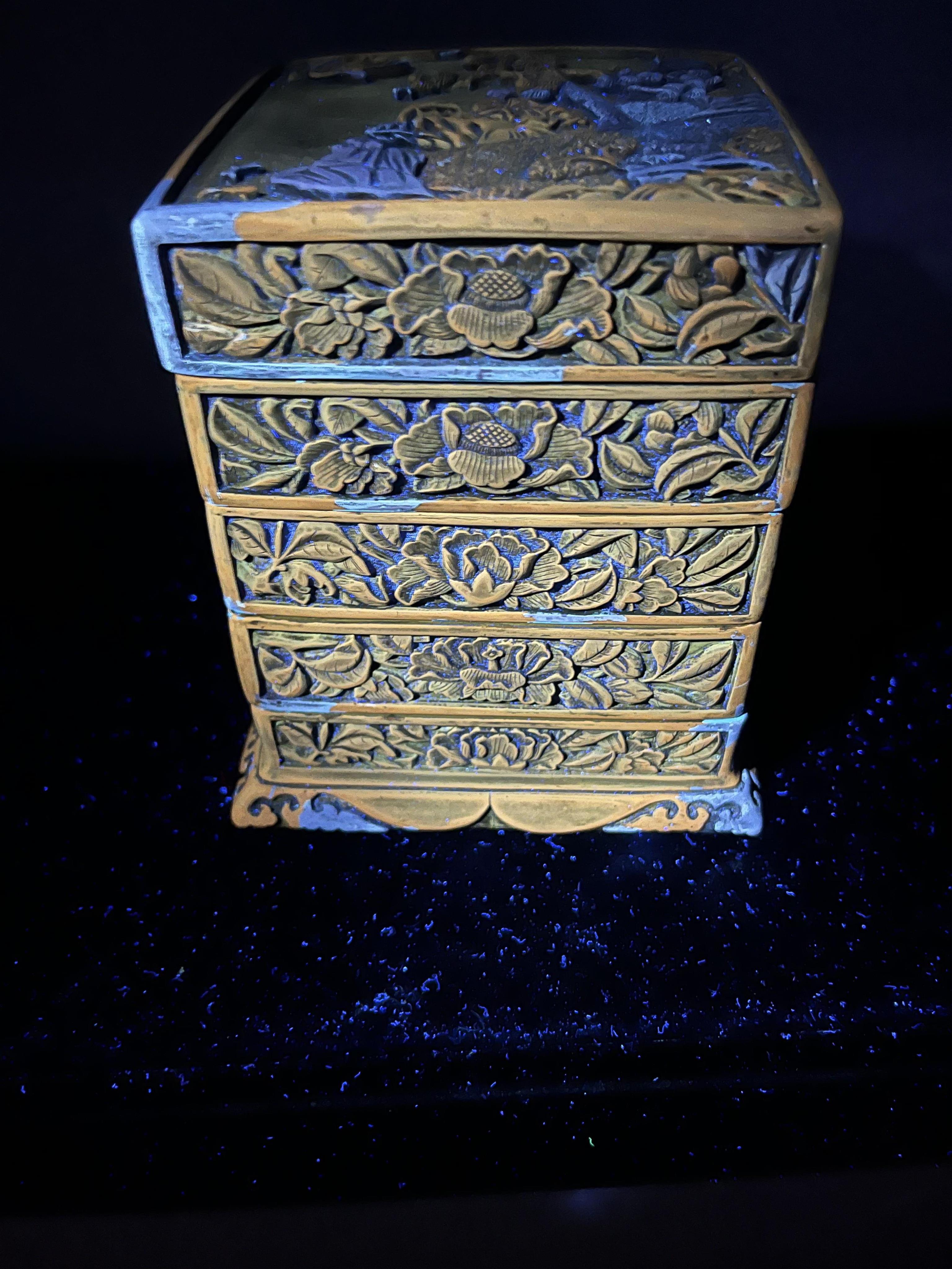A Chinese Ming cinnabar lacquer four tier box, 15th century